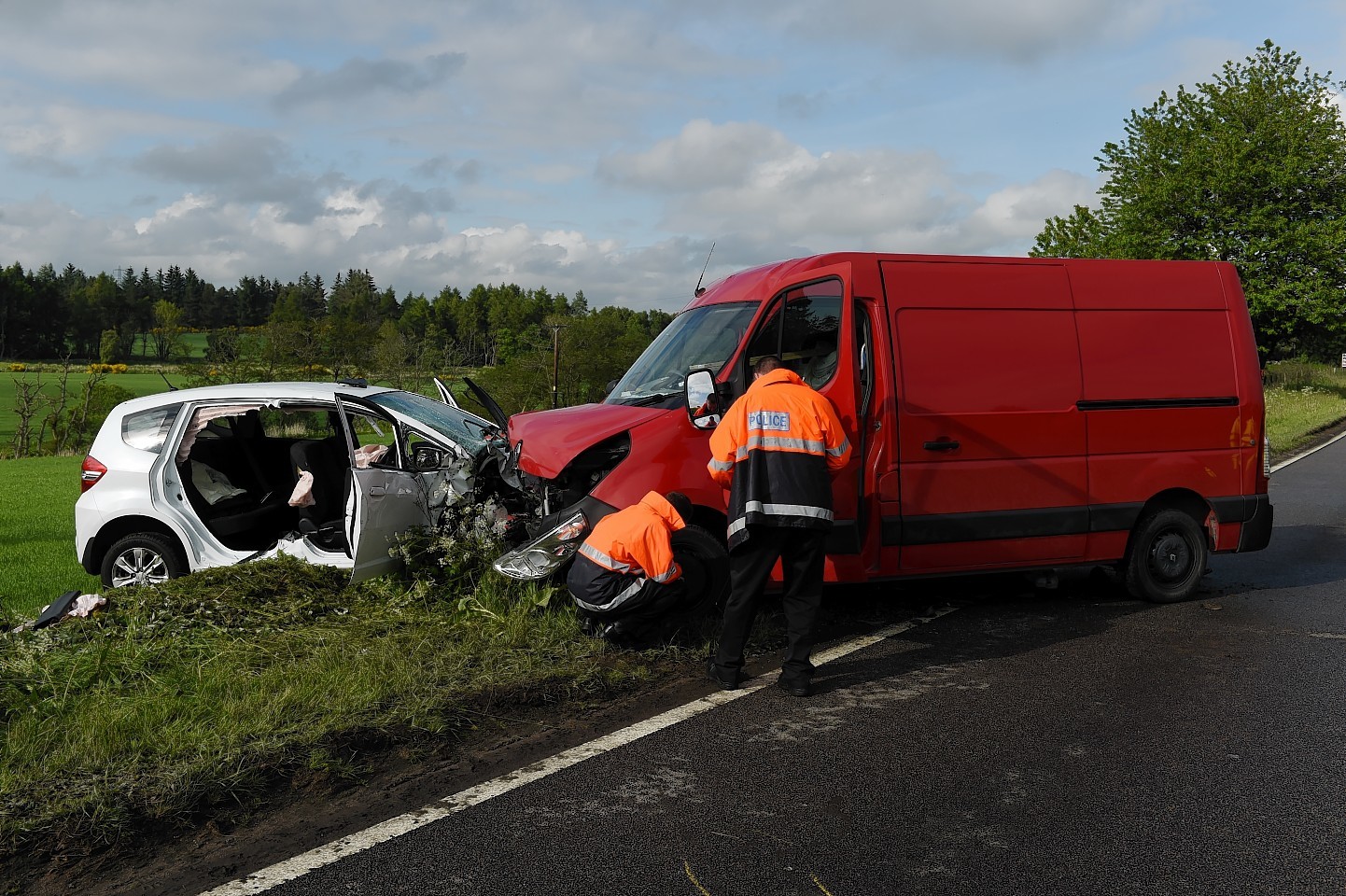 Police at the scene of the crash on the A96