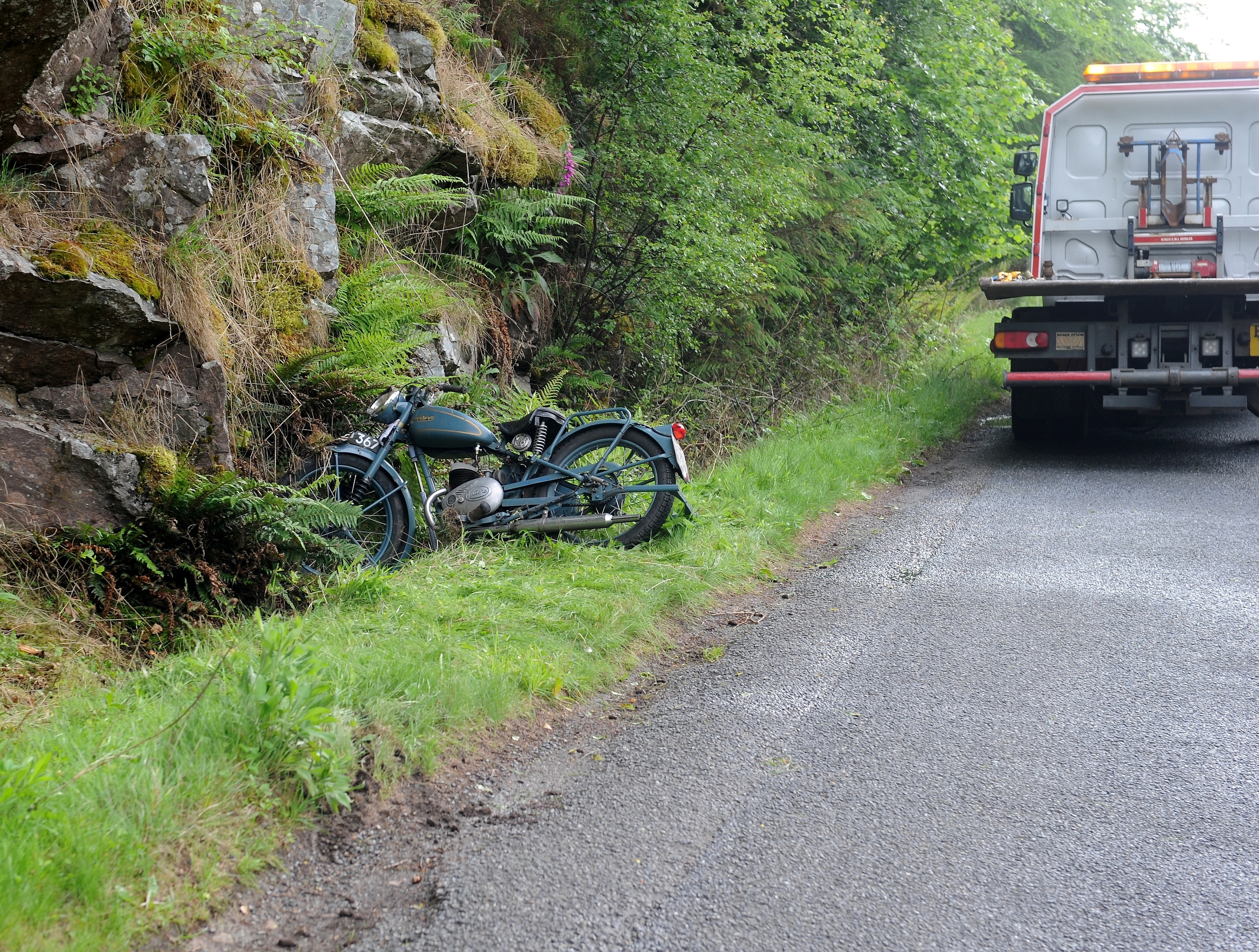 Police and recovery workers at the scene of the crash on the Dores to Foyers road