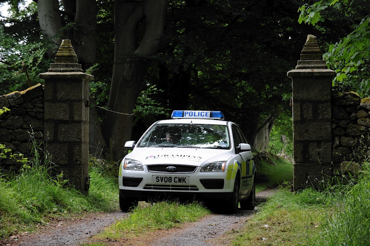 Police at the entrance to Sandy Ingram's home in 2010.
