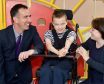 Marathon man Bryan Mills (left) with pupil Paul Latts and teacher Tara Kennedy.