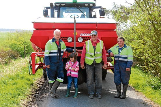 Peter Robertson, his daughter Georgina,the farm's foreman Graham Milne, and tractorman Martin Turriff.