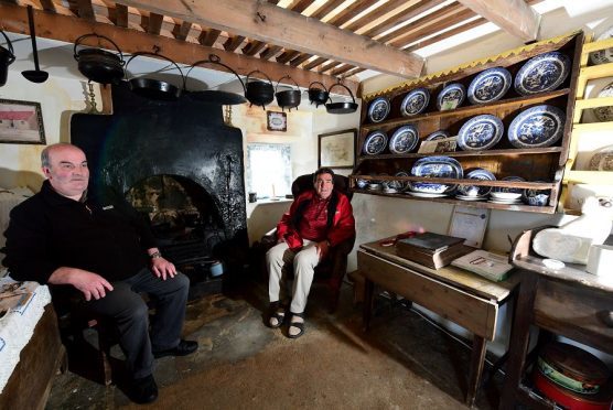 Visitor Guide Ian Geddes (left) in the house with Bruce Buchan, chairman of the Maggie's Hoosie Preservation Trust.