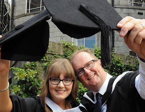 Father and daughter graduates Chloe and Billy Jackson.