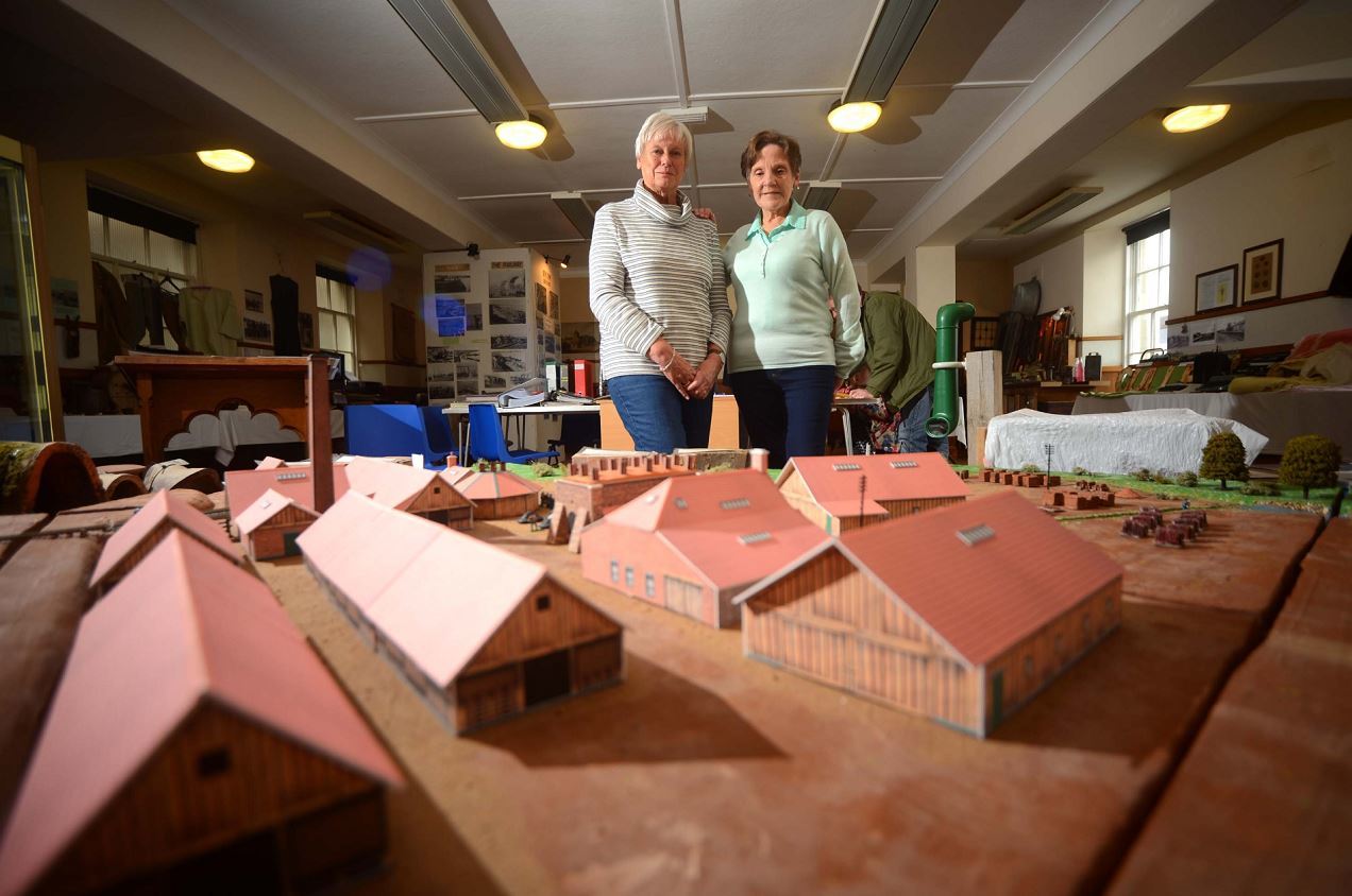 Volunteers Heather Hill and Mary Duncan with the model of the old brick factory in Cullen.