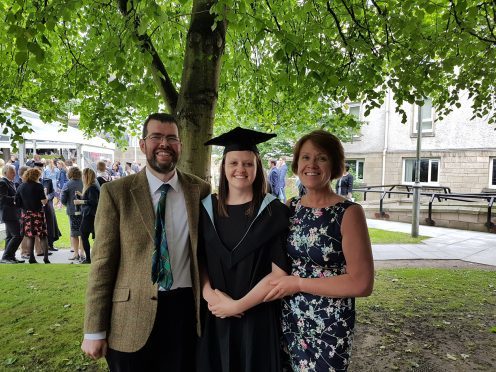University lecturer Malcolm Combe, who battled testicular cancer, with his graduating student Ashleigh Buchan and her mother Lorraine - a nurse that helped him through chemotherapy