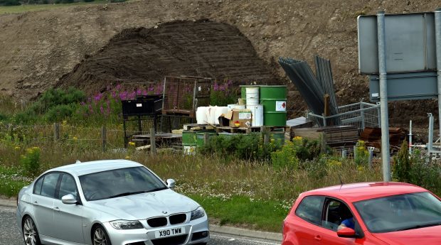 Drums of a flammable chemical used on AWPR work lie next to Dyce Drive in Aberdeen. Photograph: Colin Rennie