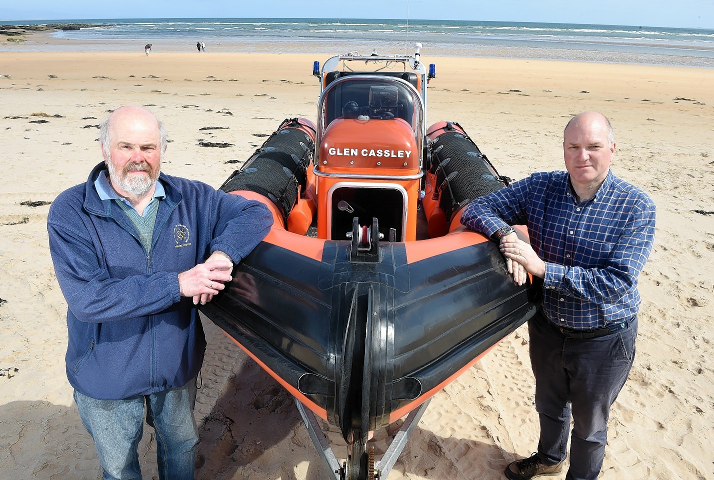 Photographed with their lifeboat on Dornoch Beach are Neil Dalton (left) Chairman of the Association and on the right Antony Hope, a crew member.