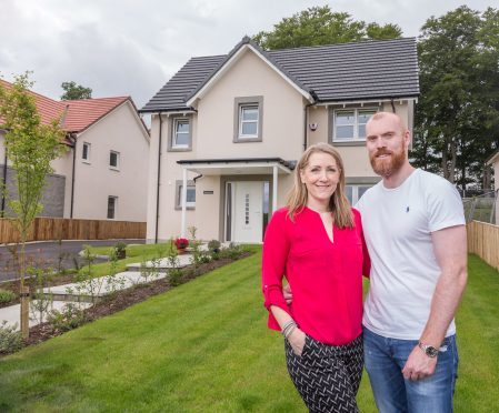 Derek and Tara Roft enjoying their new home at the Muir Homes development at Blairs Royal Deeside.

Picture Simon Price