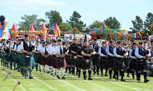 The massed pipe band perform at the Stonehaven Highland Games.