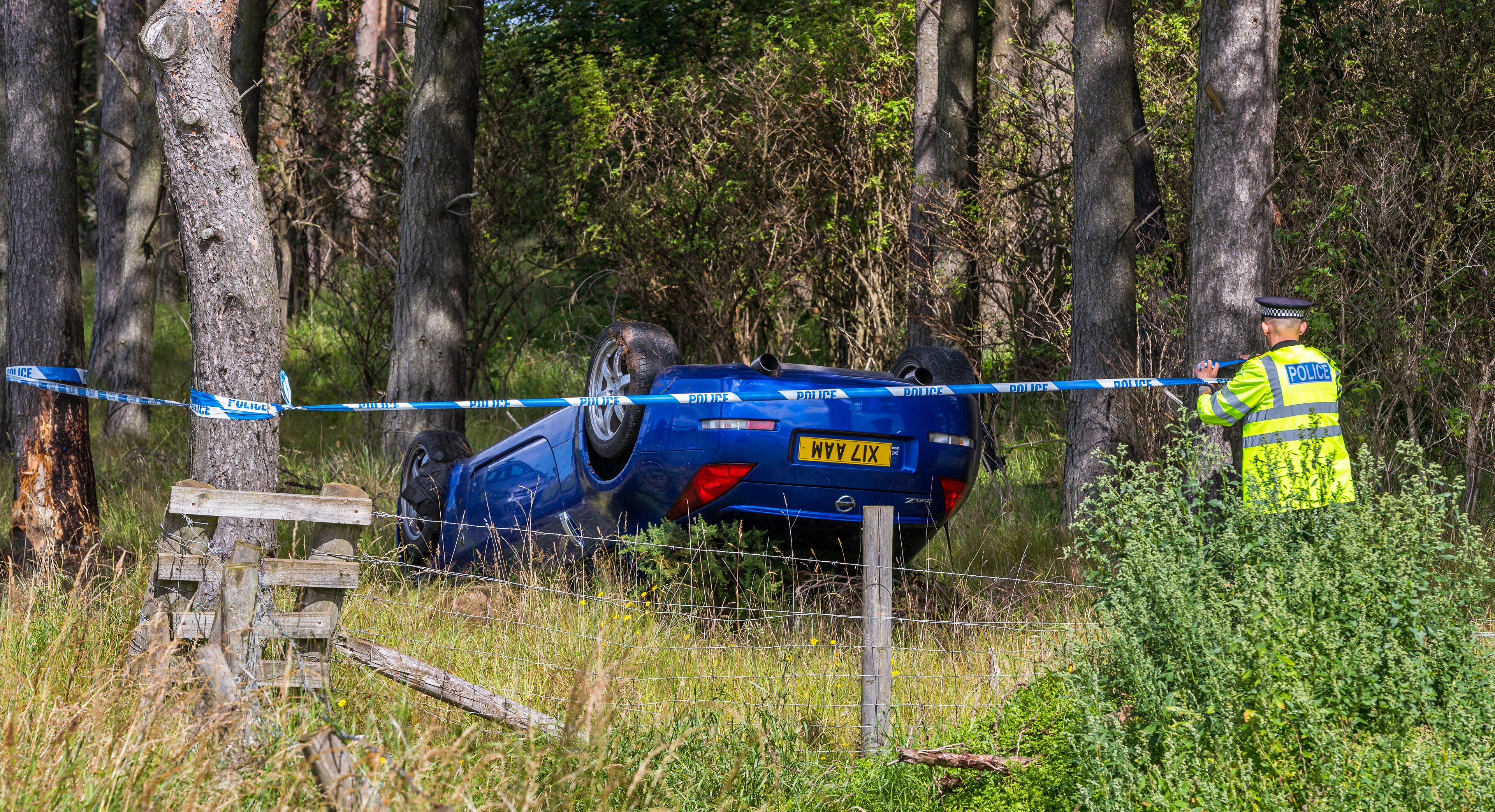 The Blue Nissan 350Z which had been travelling towards Lossiemouth on the A941 when it lost control on a right hand bend, crossed road, hit verge and tree and overturned onto its roof. The male driver was uninjured.