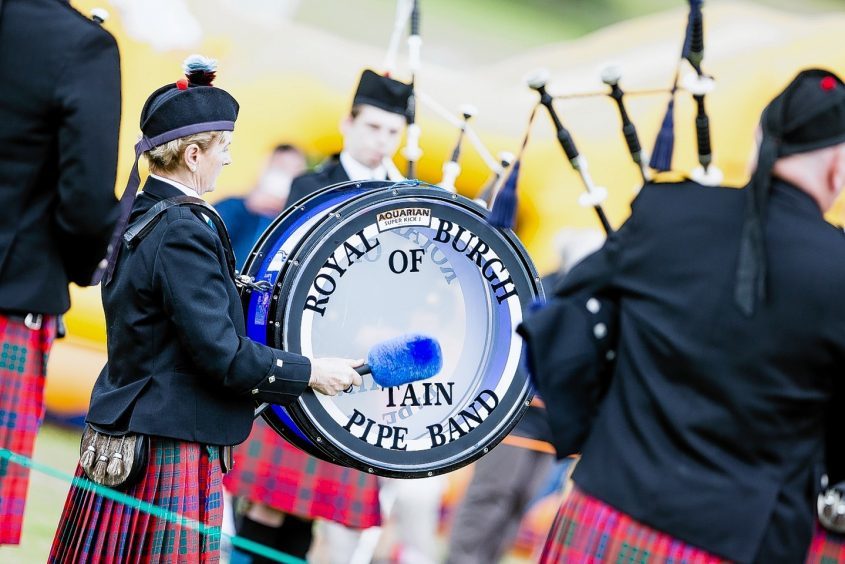The Royal Burgh of Tain Pipe Band entertain the crowd at the Tain Highland Gathering.