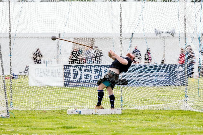 Throwing the 16lb hammer at the Tain Highland Gathering.