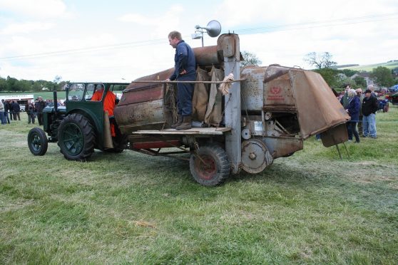 A preserved trailed Claas Super Junior Combine at a rally in 2015