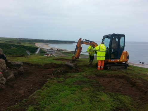 Small diggers were used to clear the way to the summit.