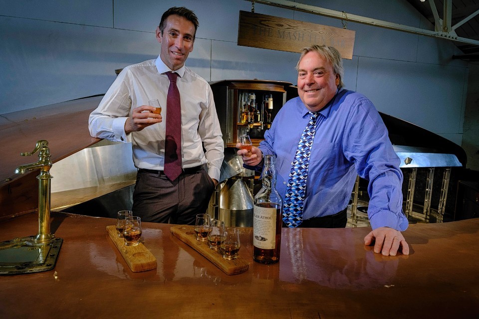 Ewan Andrew, director, Diageo Scotland, left, with Malcolm Roughead, VisitScotland chief executive at the new whisky bar at Blair Athol Distillery