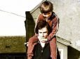 Jim Spaine Snr lifts the Dinnie Steens with son Jim jnr on his back in 1975 at the Potarch Hotel.