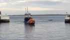 The Fraserburgh lifeboat returns to port after rescuing the vessel.