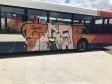 The graffiti was sprayed on the side of the Stagecoach bus while it was parked near a cemetery