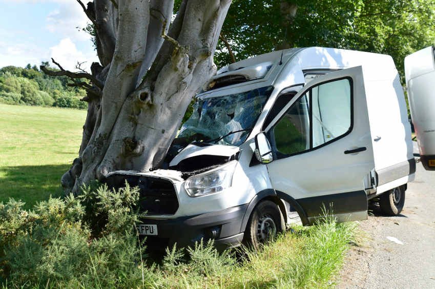 Van driver cut free after colliding with tree near north-east village