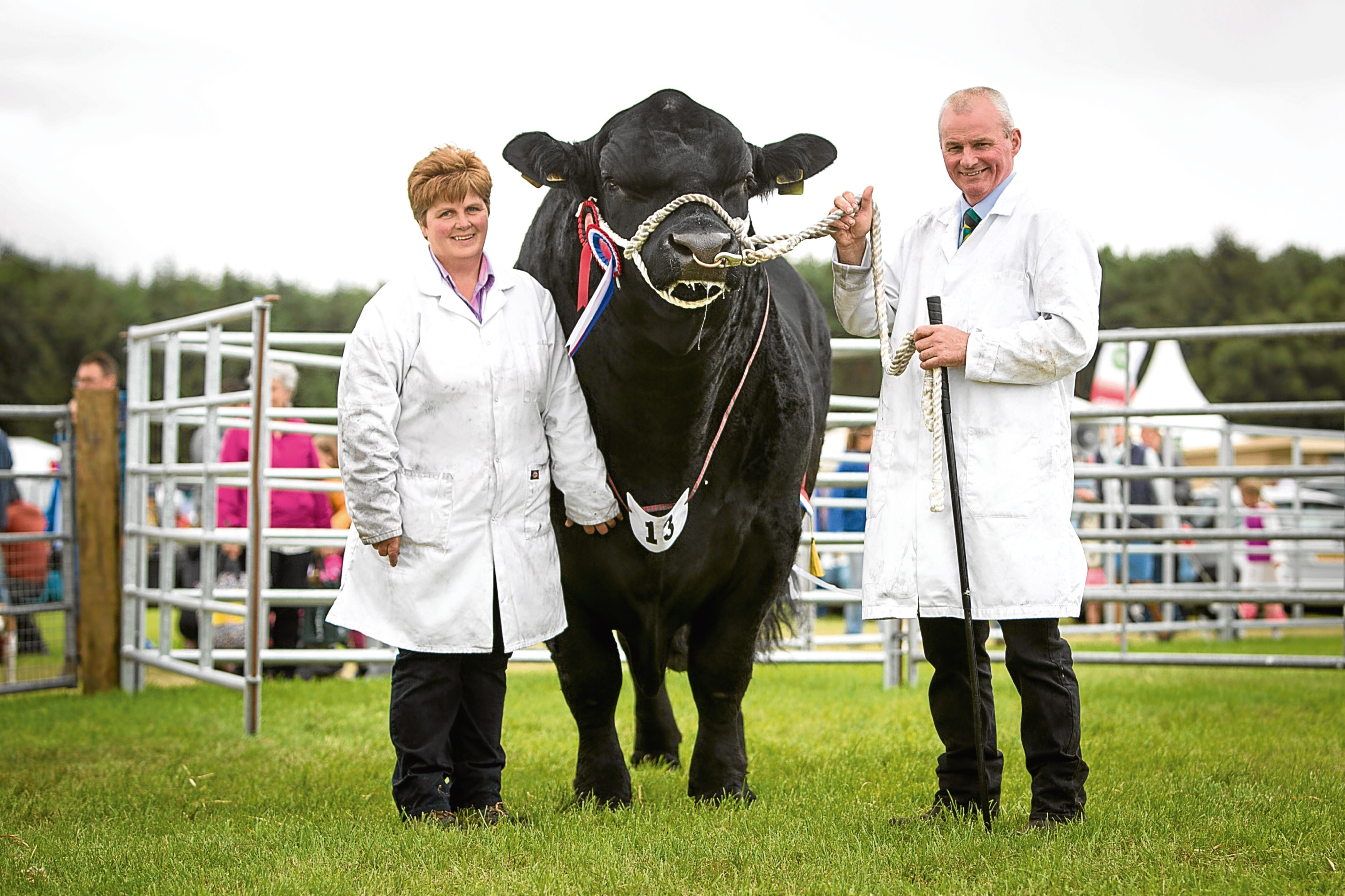 Susan and David Johnstone with supreme show champion of champions Ballindalloch Earl