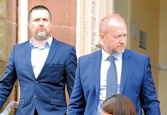 Steve Cardno and Mark Syme (right) of Whytes Crane Hire leave Inverness Sheriff Court