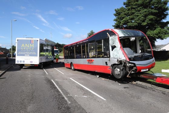 2 August 2017: Scene of an RTC involving a bus and an exhibition trailer on the A96 at the Gulf petrol station in Nairn. It is understood that the trailer was being towed west to the Black Isle Show when it became detached from the lorry that was towing it, and collided with a bus heading east. The lorry that had been towing the trailer was taken away from the scene, where it was inspected by police and representatives from the Driver & Vehicle Standards Agency. A towing hitch could be seen on the grass verge close to the scene of the collision. The road was closed in both directions with diversions in place, with some local traffic allowed to pass the scene via the petrol station forecourt. Picture: Andrew Smith