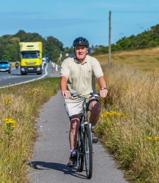 Council leader George Alexander cycled from Forres to the meeting to show his support for the plans