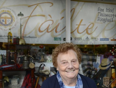 Renowned Gaelic singer, Mod Gold Medallist and conductor of many choirs, Chrissie MacEachan had the honour of opening the Mod Shop in Fort William High Street.