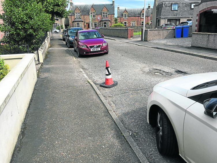 Fedup residents use ‘illegal’ cones to keep parking spaces