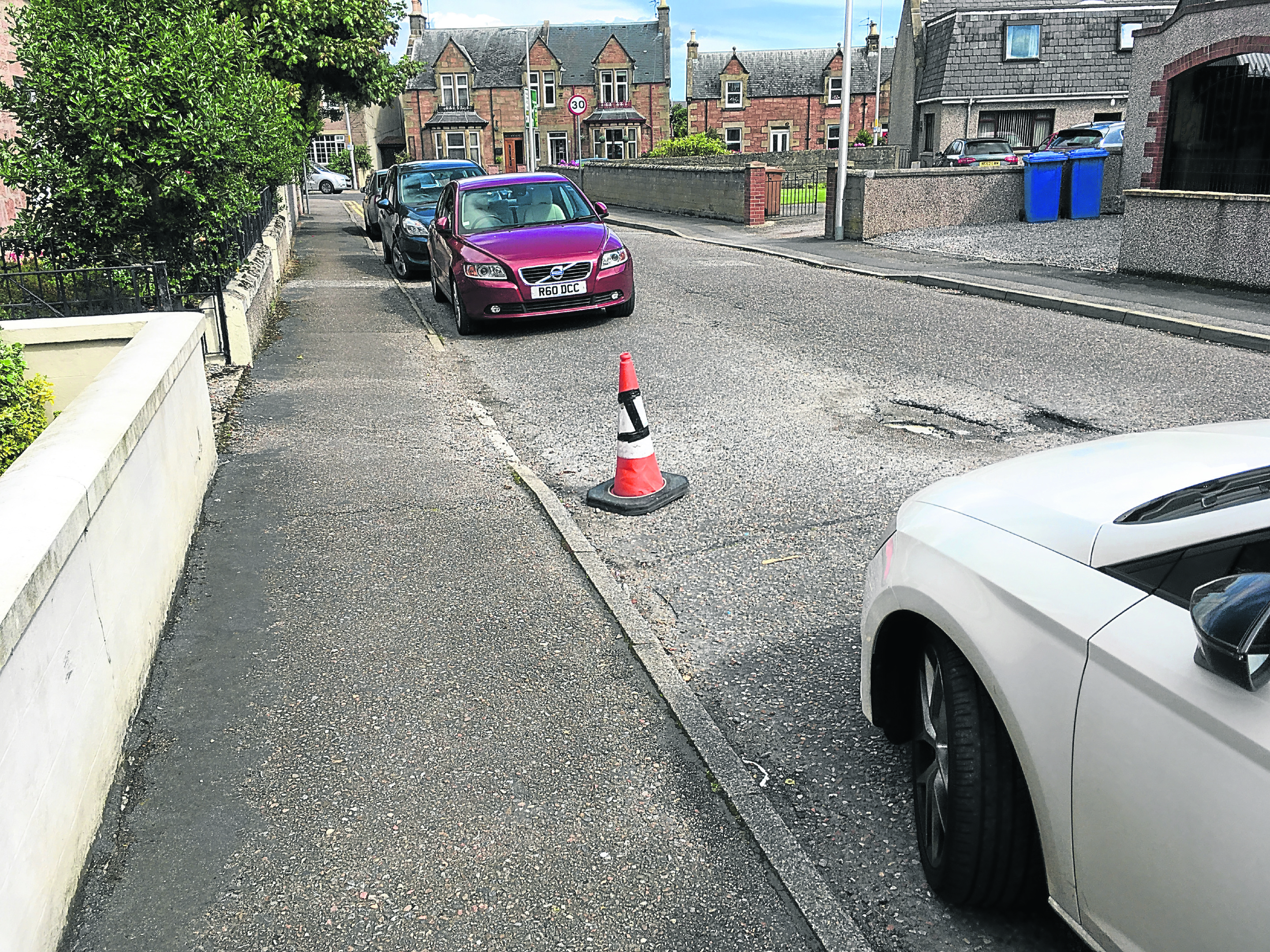 Traffic cones put on an Inverness street by residents to stop others parking there