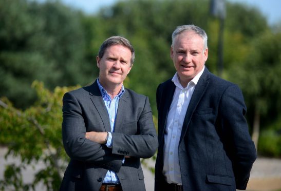 Alasdair Pattinson, general manager of Dr Gray's Hospital, and Moray MSP Richard Lochhead