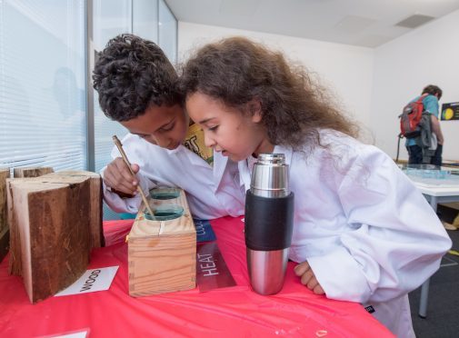 Oliver and Gabrielle Njugana solving a science puzzle