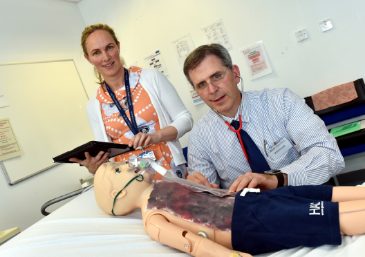 A delegation from ARCHIE's twin hospital in New Hampshire, USA visited ARCHIE in Aberdeen and was shown a state of the art robotic child which is being used for training. Pictured are Paediatric consultant Melanie Clarke with USA Dr Keith Loud and 'child'  Hal.
Picture by COLIN RENNIE