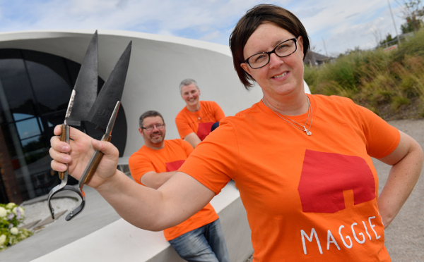 Angela Findlay shears in hand (front) with her husband Scott Findlay who was waxed and Fiona Walker who had her head shaved to raise funds for Maggie's.