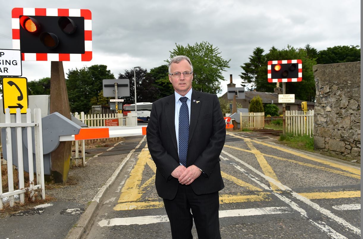 Fergus Hood at the problem level crossing in Kintore. (Picture: Kenny Elrick)