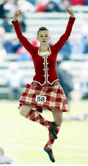 A competitor takes part in Highland Dance competition during the Braemar Gathering in Scotland in 2008