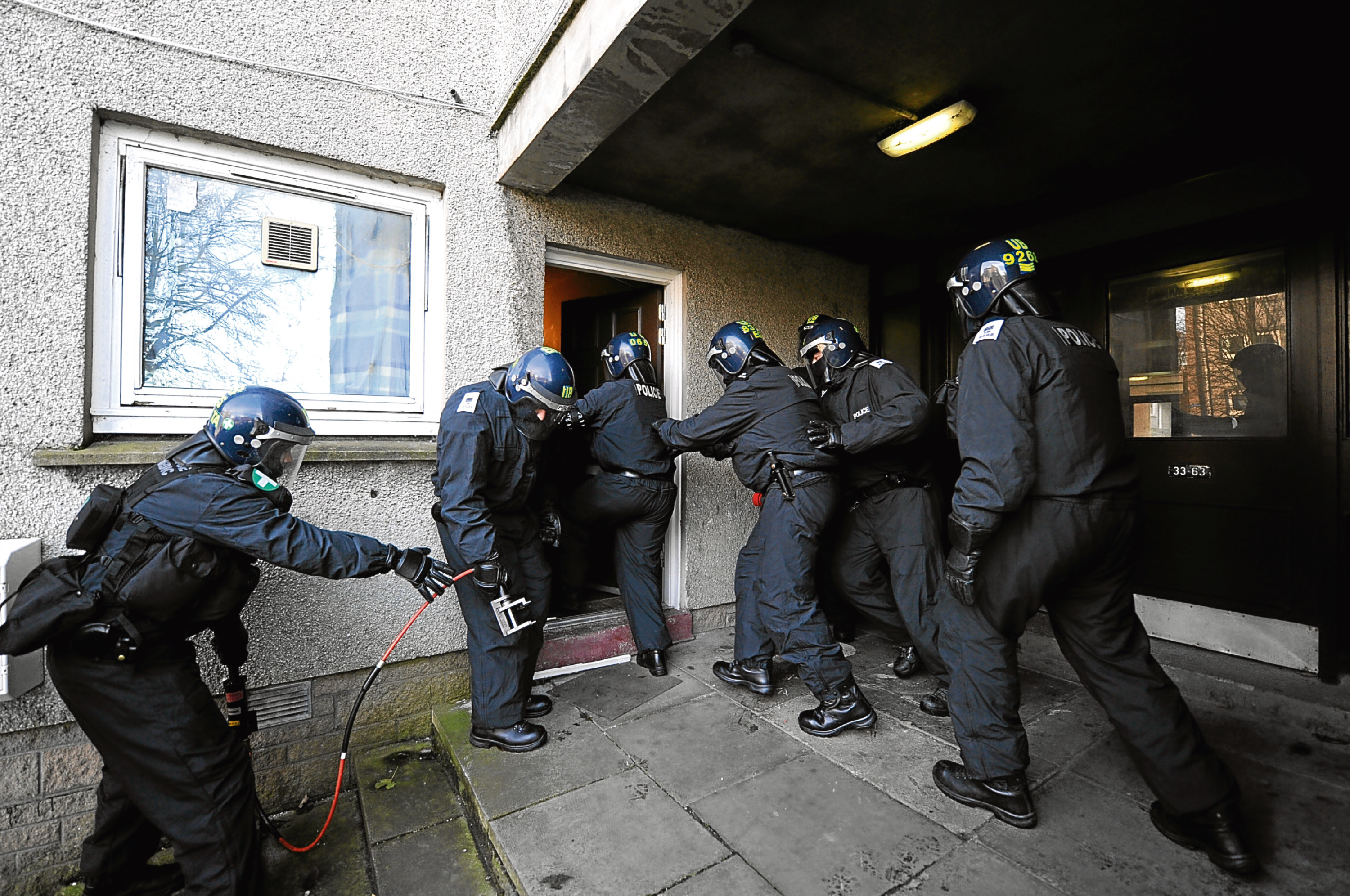 First anniversary of the launch of Operation Maple.   

Pictured - Grampian Police carry out a raid at a home in Tedder Road, Tillydrone, as part of Operation Maple.     

Picture by KAMI THOMSON          .27-10-11