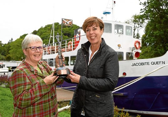 Freda Newton of Loch Ness by Jacobite receives the SCDI Highlands and Islands Chairs Award for Outstanding Business Achievement from Jane Cumming.