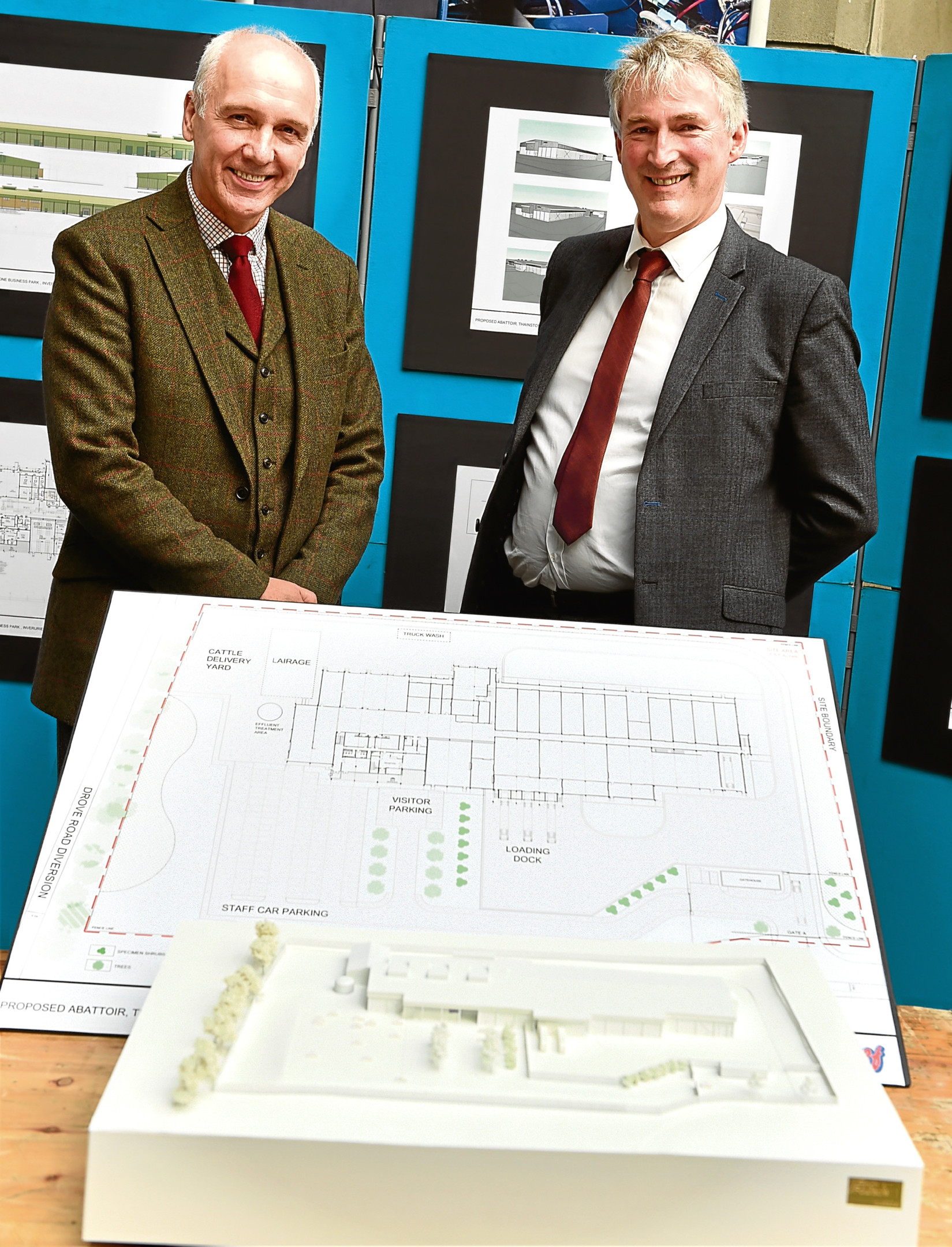 Uel Morton and David Nimmo with plans at the public exhibition