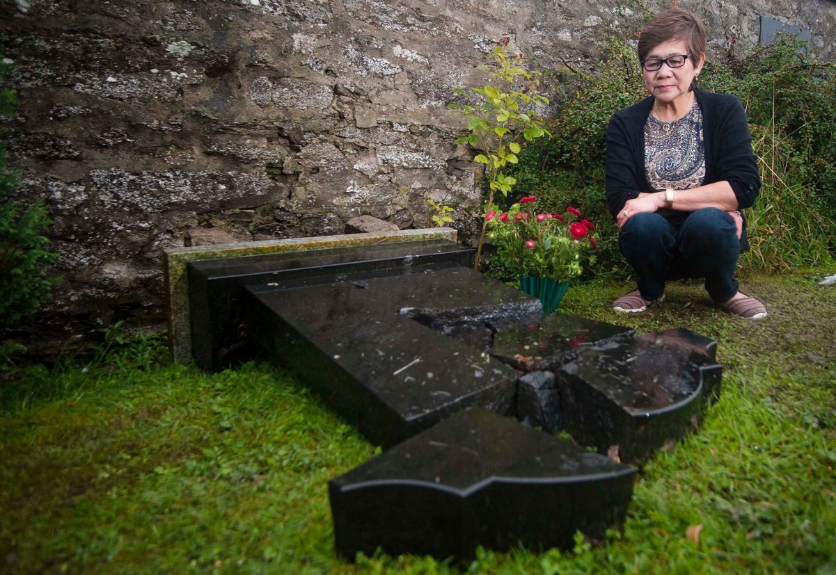 The gravestone remembering Aida Stewart's husband, Joseph, has been broken into pieces.