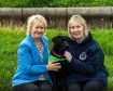 Cabinet Secretary for Environment, Climate Change and Land Reform, Roseanna Cunningham MSP, outside Holyrood today, Dee McIntosh, Battersea Dogs & Cats Home Director of Communications with Holly, a 4 year old black Labrador.