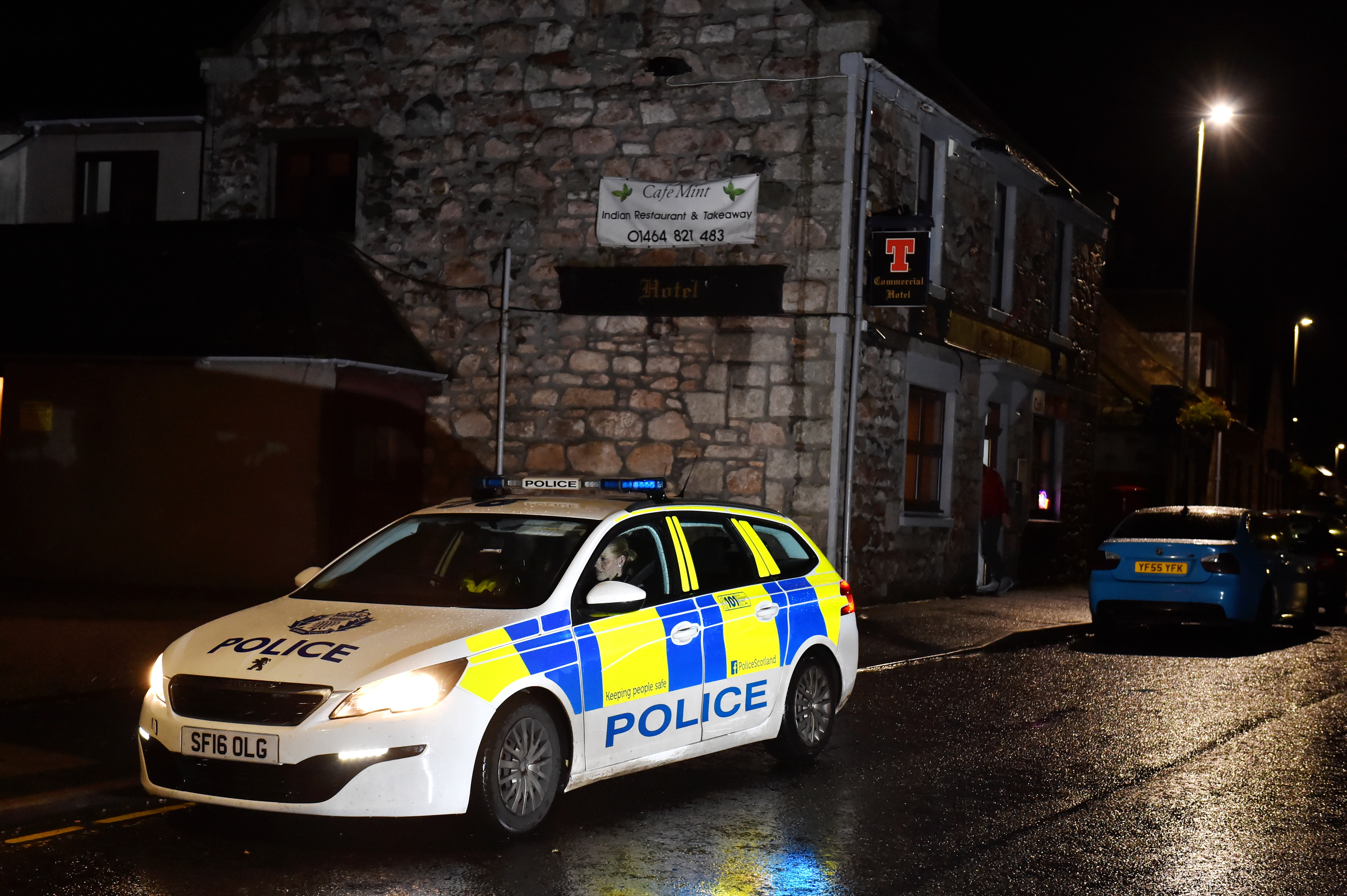 Police at the scene of the incident outside the Commercial Hotel, Insch.