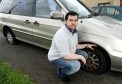 Lachlan Louden of Wester Inshes Place, Inverness with his mother's car which has had three of its tyres punctured. Pic by Sandy McCook