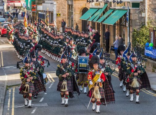 4 Scots marching down Elgin's South Street.