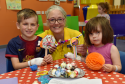 The Archie Foundation is holding a fundraising ball this October, and they’re working with children at Royal Aberdeen Children's Hospital to make some storybook-themed table decorations for the event. 
Picture of (L-R) James Baron, 7, artist Fiona Chance and Stephanie Talbort, 2, making Charlie and the Chocolate Factory sweets.
Picture by KENNY ELRICK