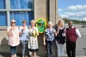 The Keig defibrillator group toast the new addition - (L-R) - Yvonne Buckingham, Diane Forbes, Celia Williams, Etta Kellock, 
                                         Rosie Marshall and Rory Williams