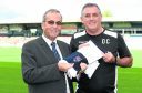 Owen Coyle meets the press as he is unveiled as Ross County's new manager, alongside chairman Roy McGregor (left)