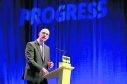 Deputy First Minister of Scotland John Swinney delivers the opening address to delegates at the  Scottish National Party (SNP) conference at the SEC Centre in Glasgow.
