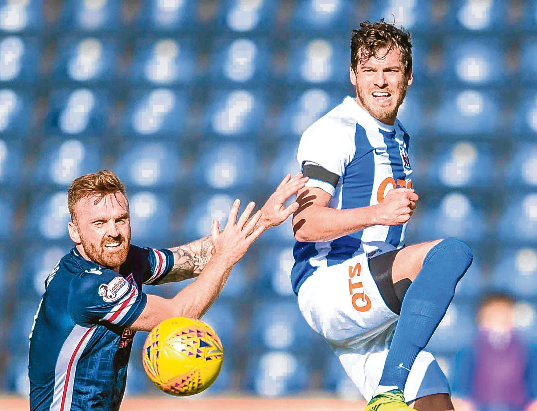 Ross County's Craig Curran (L) in action against Gordon Greer
