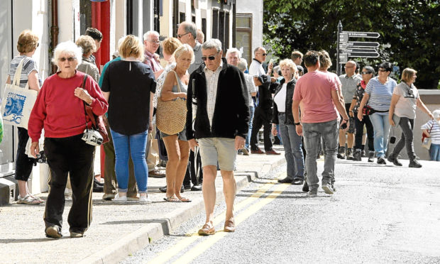 The streets of Portree, the main town of Skye, are flooded with tourists